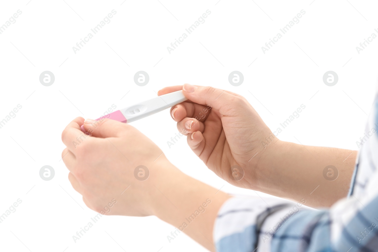 Photo of Young woman with pregnancy test on white background, closeup. Gynecology and childbirth