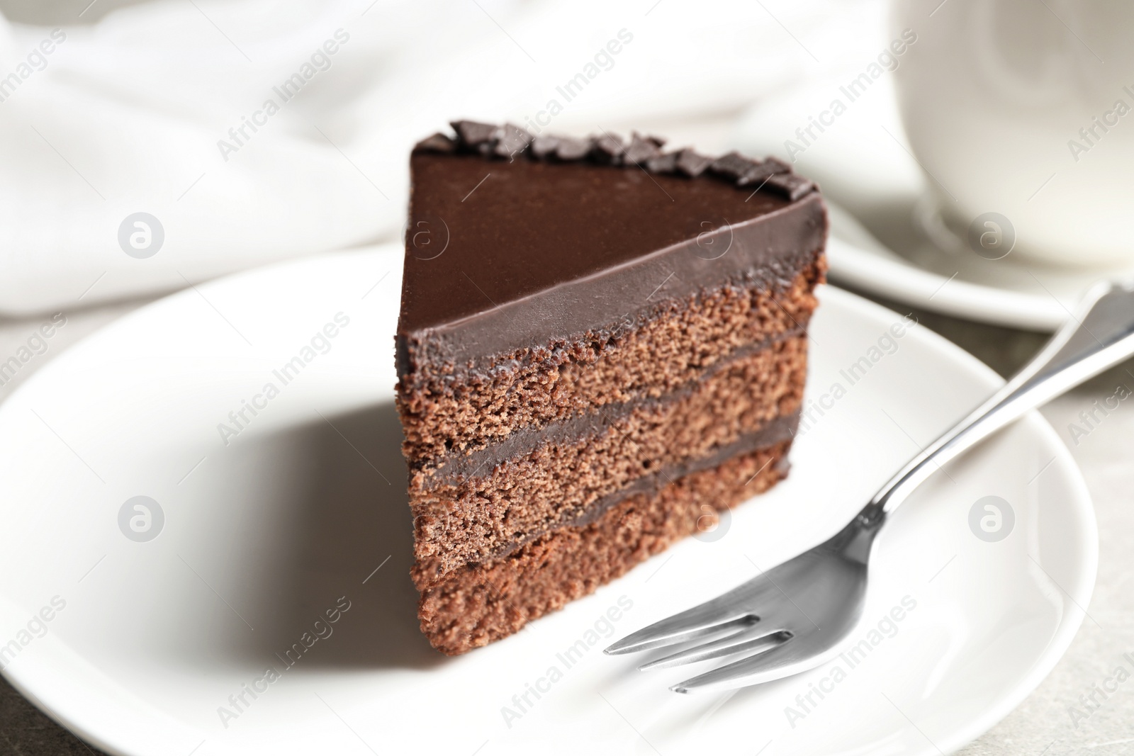 Photo of Piece of tasty chocolate cake served on plate