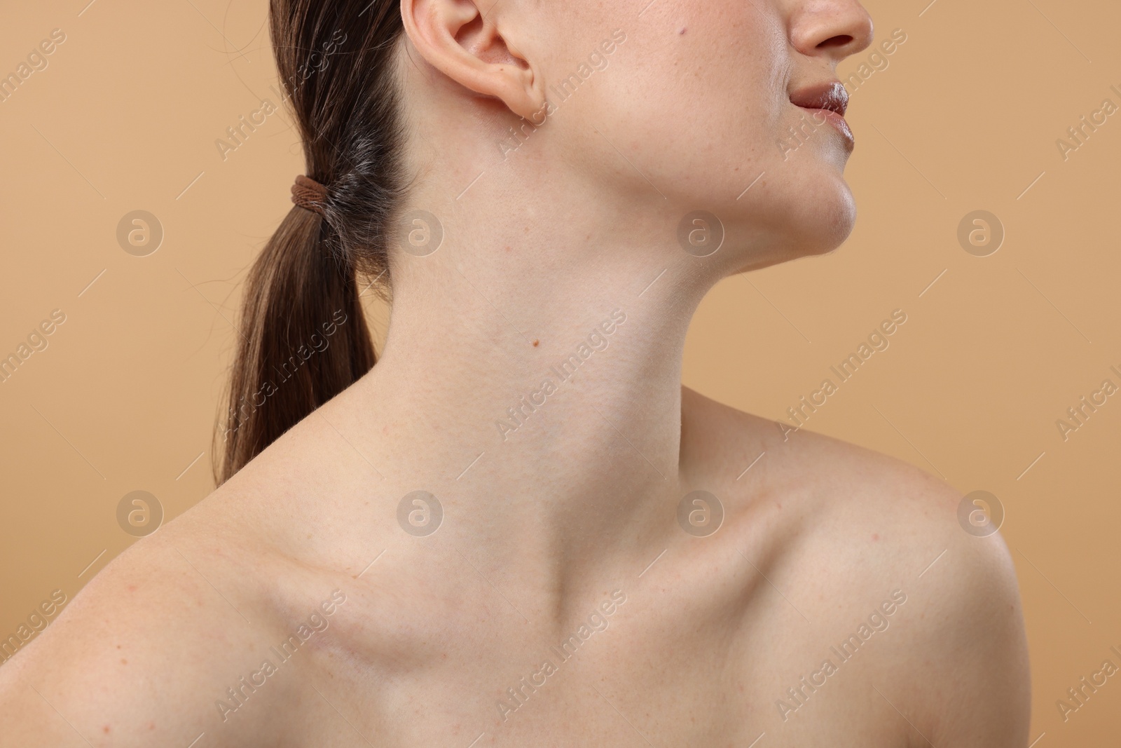 Photo of Beauty concept. Woman on beige background, closeup