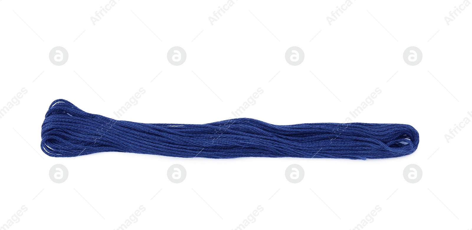 Photo of Bright blue embroidery thread on white background