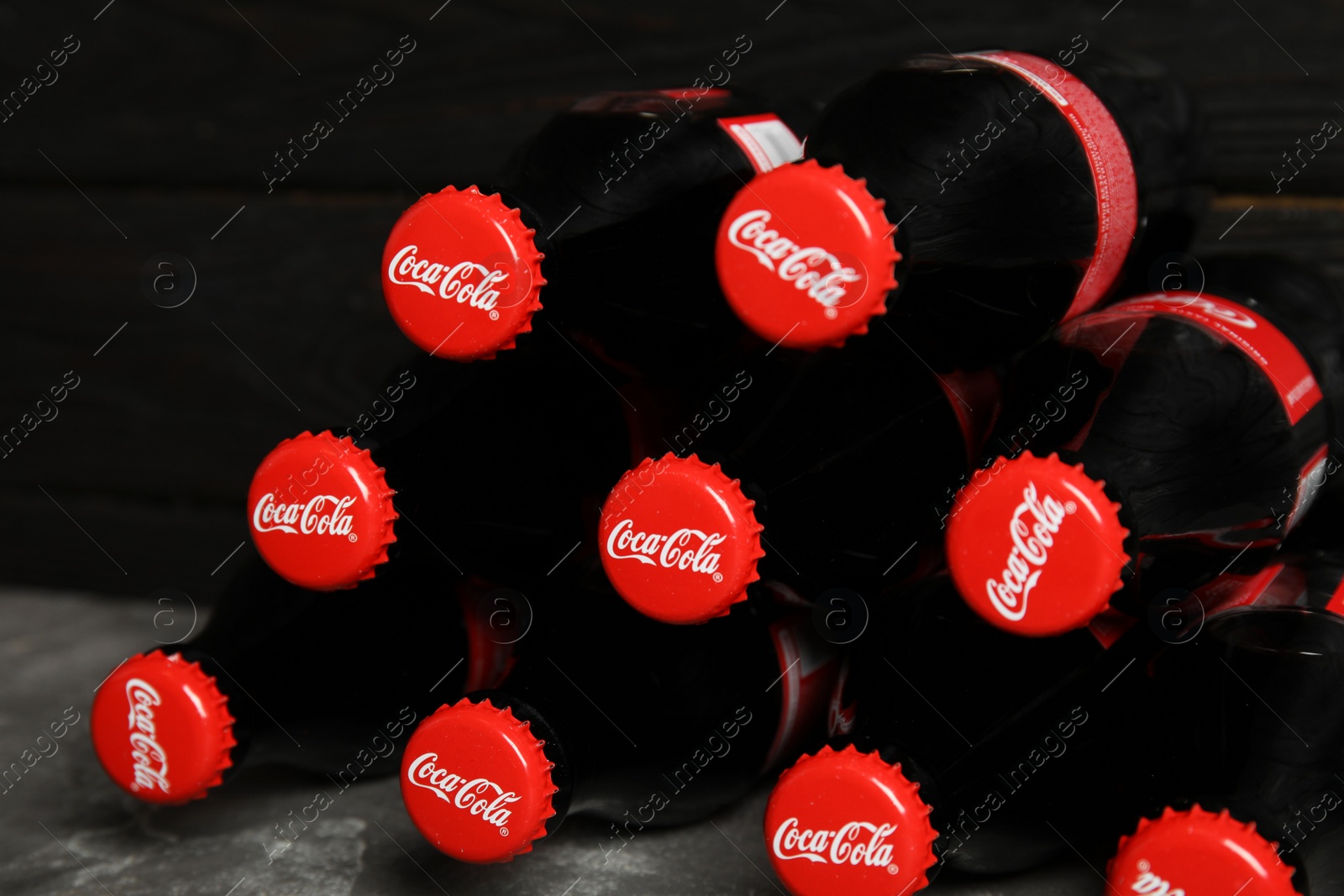 Photo of MYKOLAIV, UKRAINE - NOVEMBER 15, 2018: Bottles of Coca Cola on table, closeup