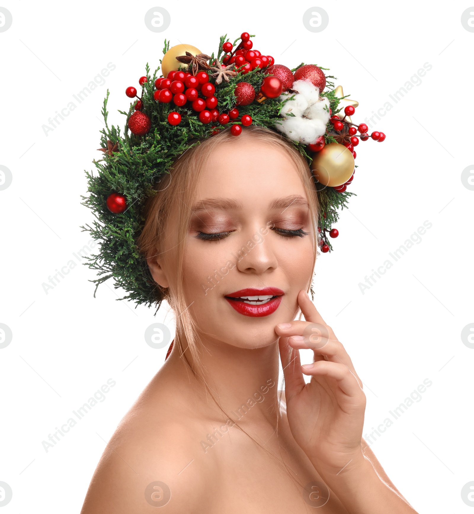 Photo of Beautiful young woman wearing Christmas wreath on white background