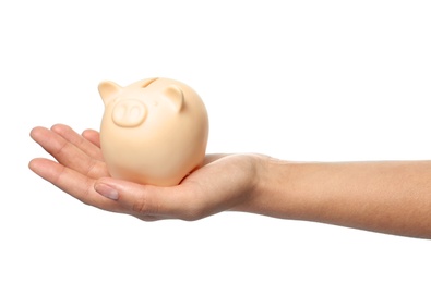 Young woman holding piggybank on white background, closeup view