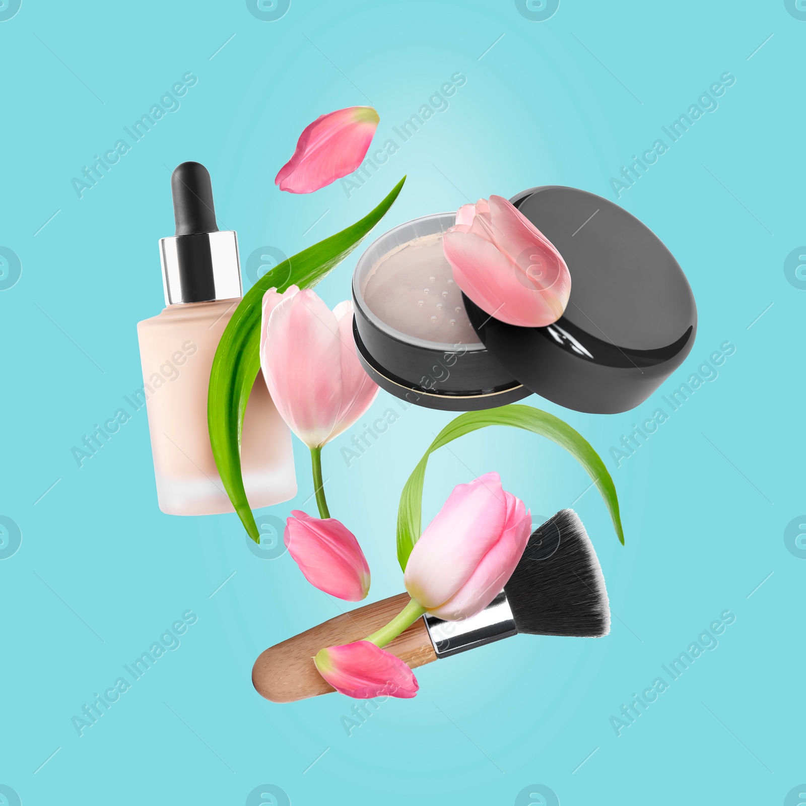 Image of Spring flowers and makeup products in air on light blue background