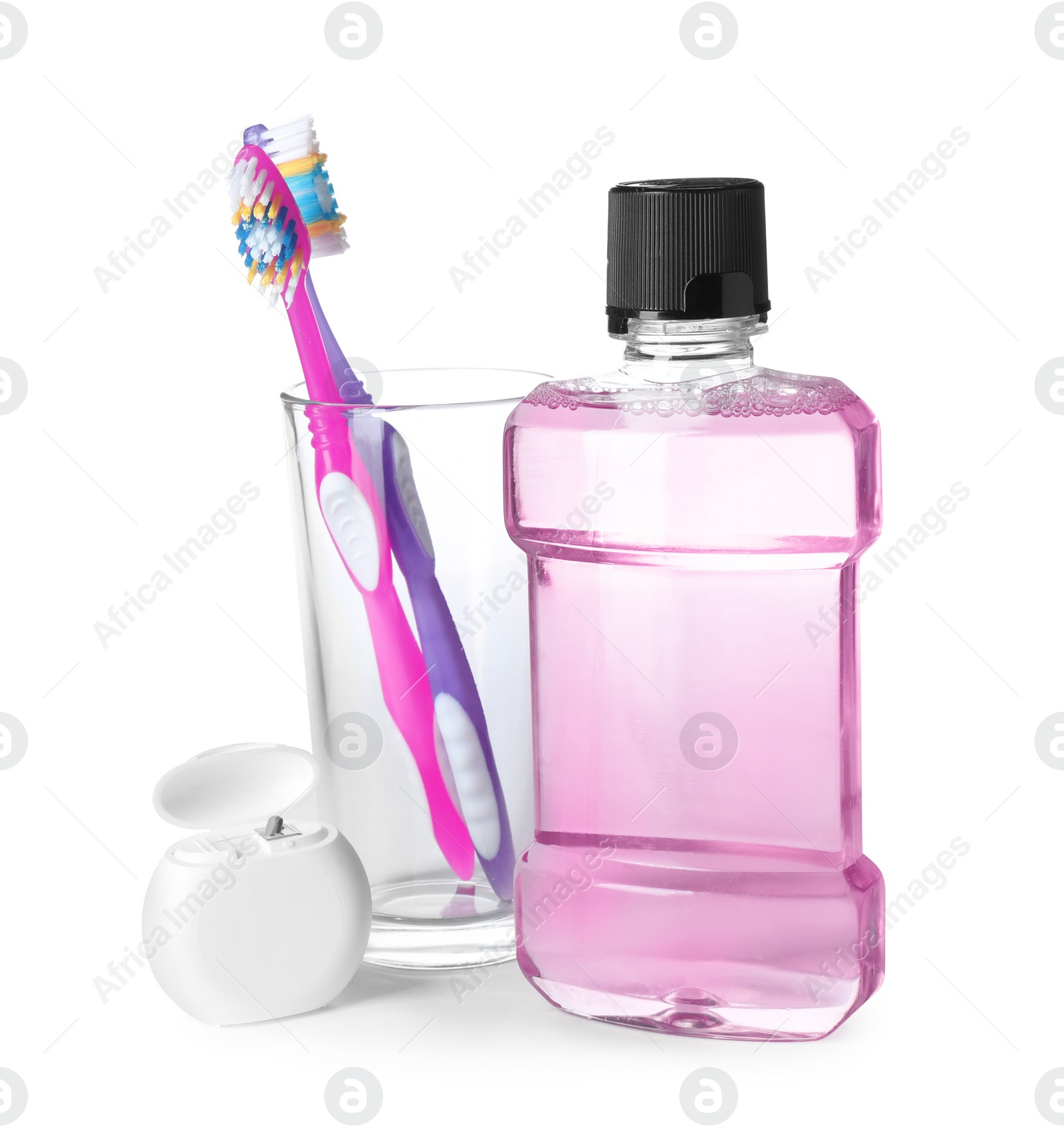 Photo of Mouthwash and other items for teeth care on white background