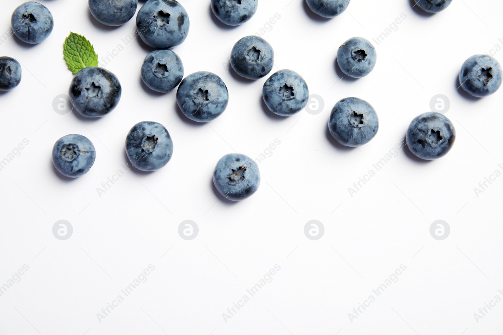 Photo of Flat lay composition with tasty blueberry and space for text on white background