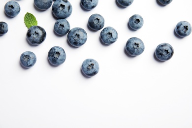 Flat lay composition with tasty blueberry and space for text on white background