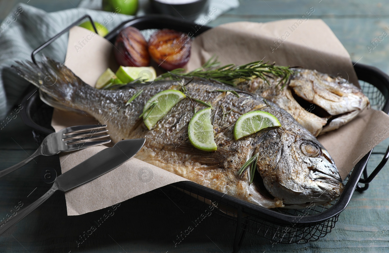 Photo of Delicious baked fish served on wooden rustic table, closeup. Seafood