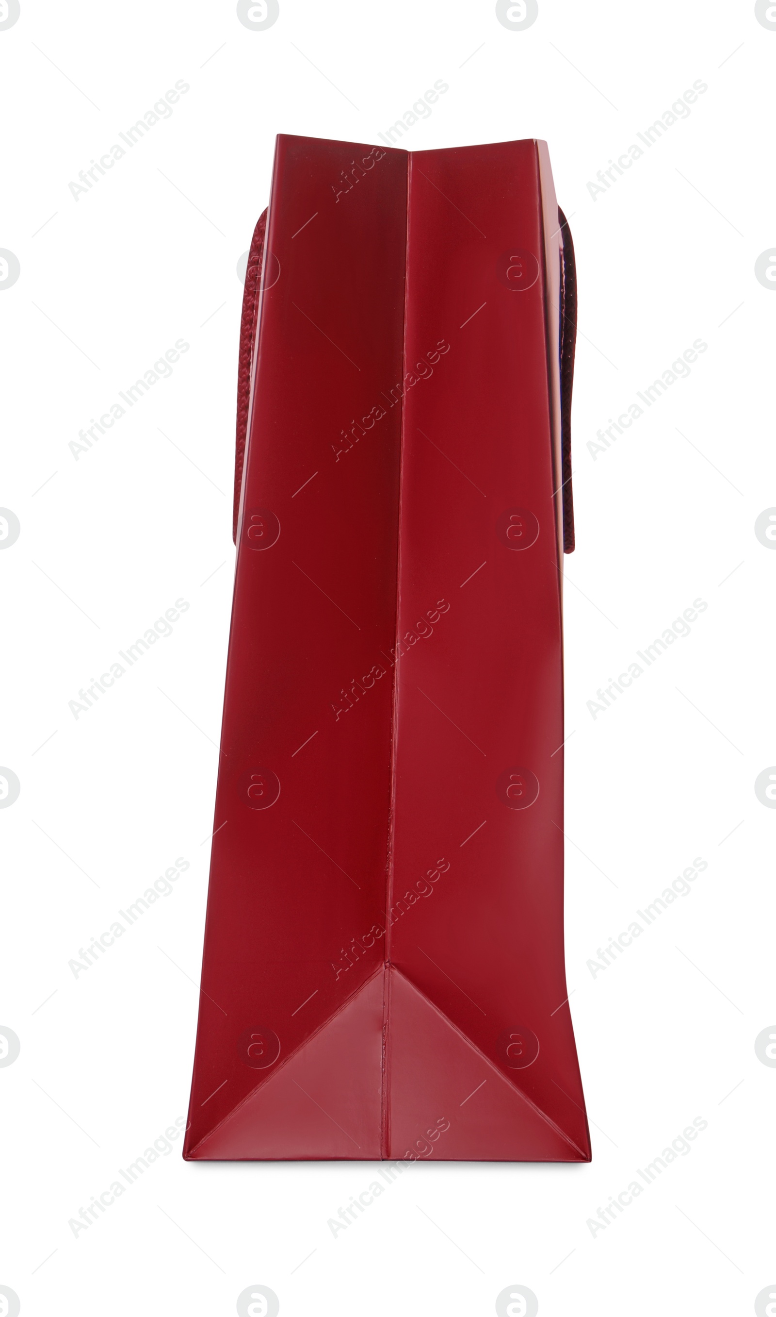 Photo of One red shopping bag isolated on white