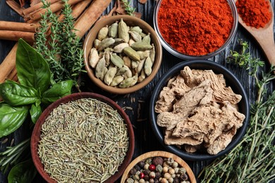 Photo of Different natural spices and herbs on table, flat lay