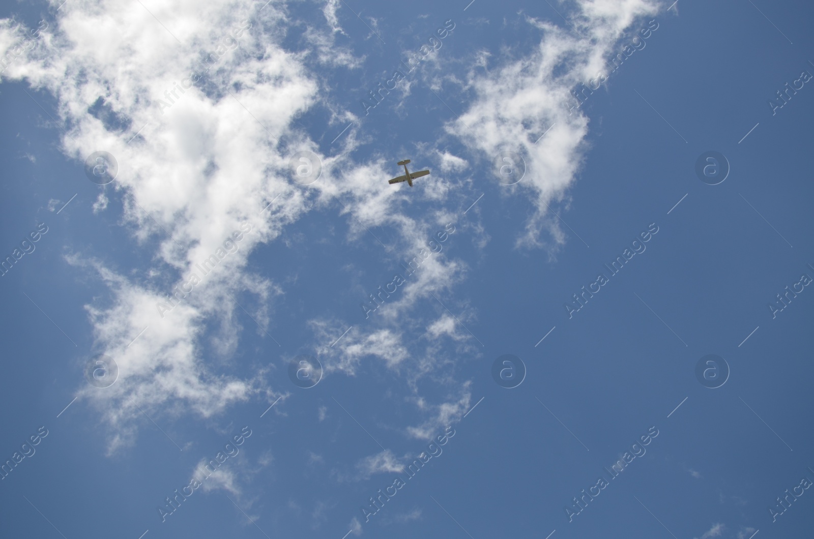 Photo of Modern airplane flying in sky with clouds