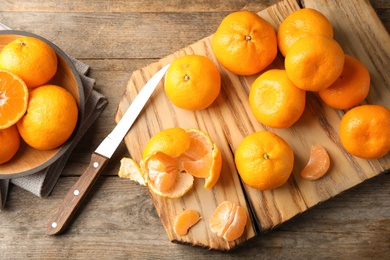Photo of Flat lay composition with ripe tangerines on wooden background