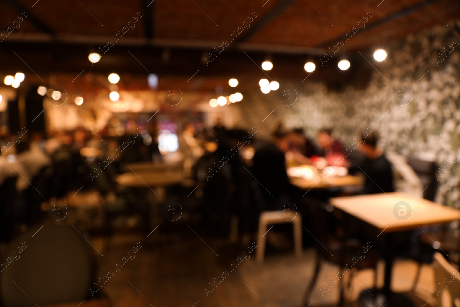 Photo of Blurred view of cafe interior with bokeh effect