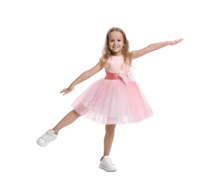 Photo of Cute little girl in beautiful dress dancing on white background