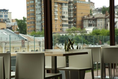 Observation area cafe. Tables and chairs against beautiful cityscape