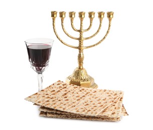 Traditional matzos, red wine and menorah on white background