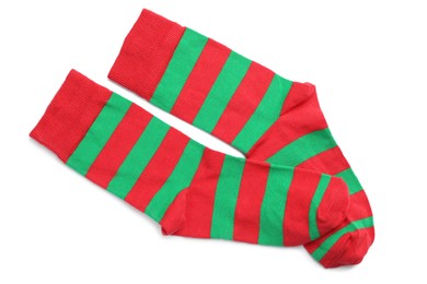 Pair of striped socks on white background, top view