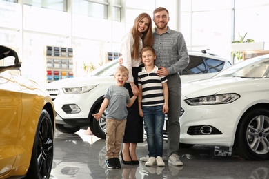 Young family in car salon