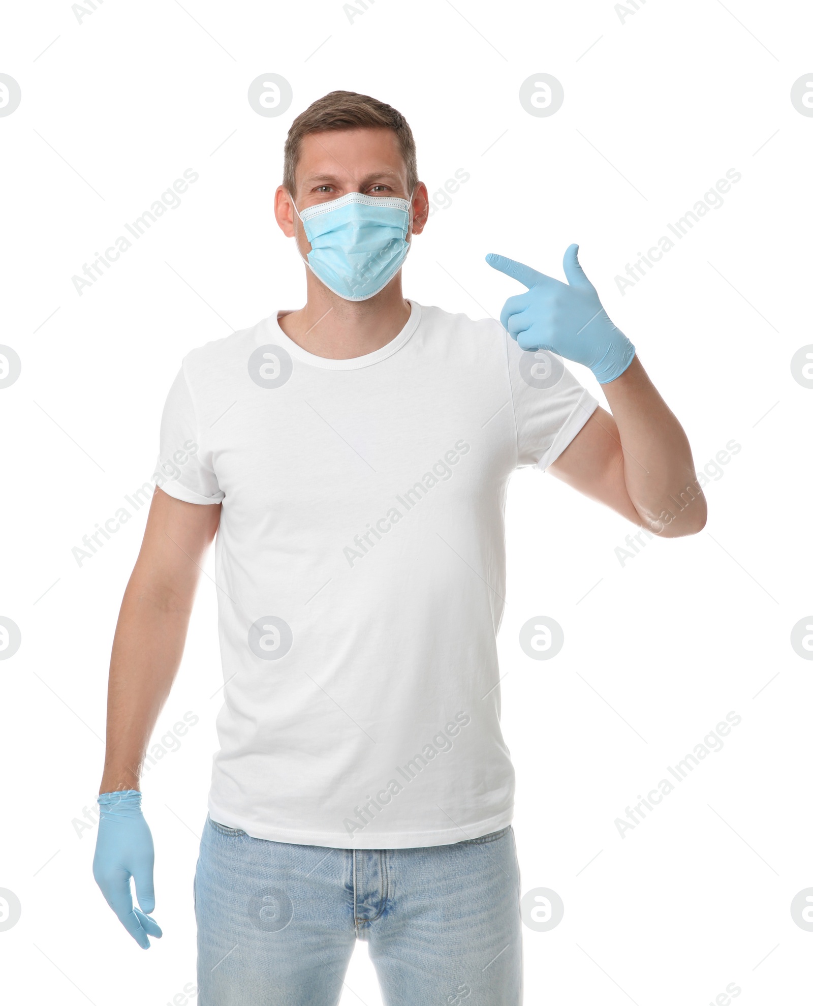 Photo of Male volunteer in mask and gloves on white background. Protective measures during coronavirus quarantine