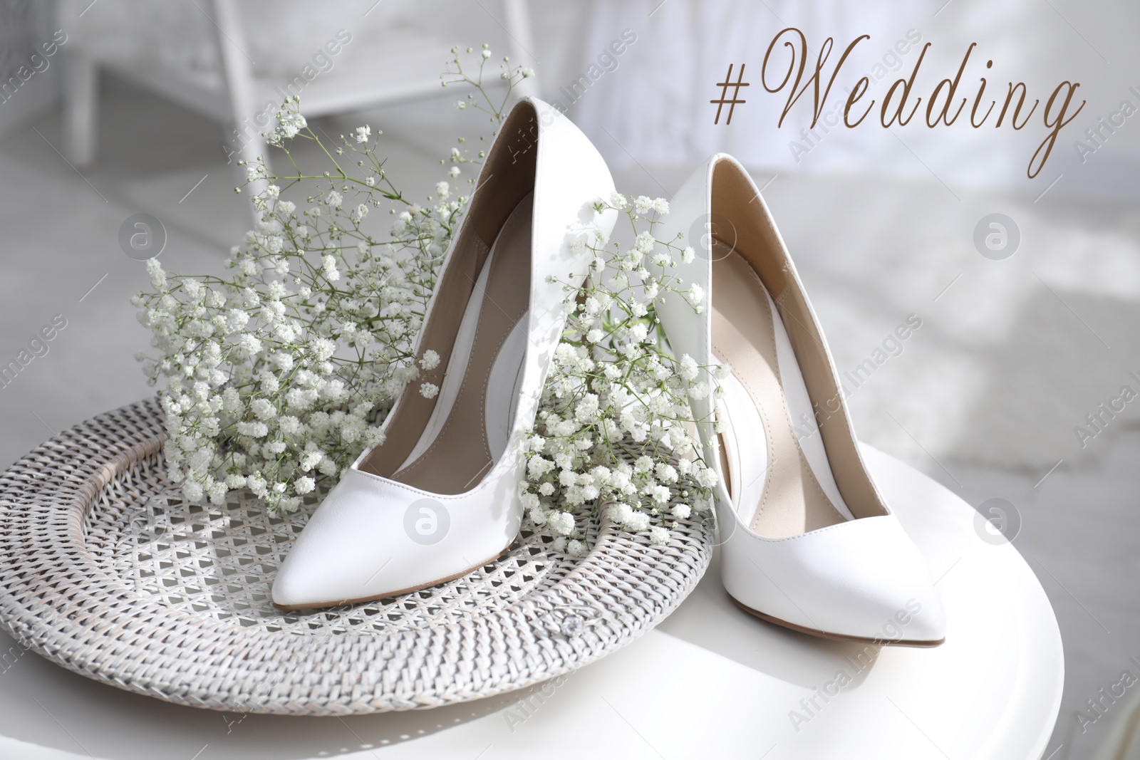 Image of Hashtag Wedding, beautiful shoes, engagement ring and flowers on table indoors