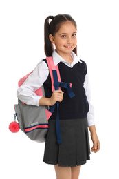 Photo of Little girl in school uniform with backpack on white background