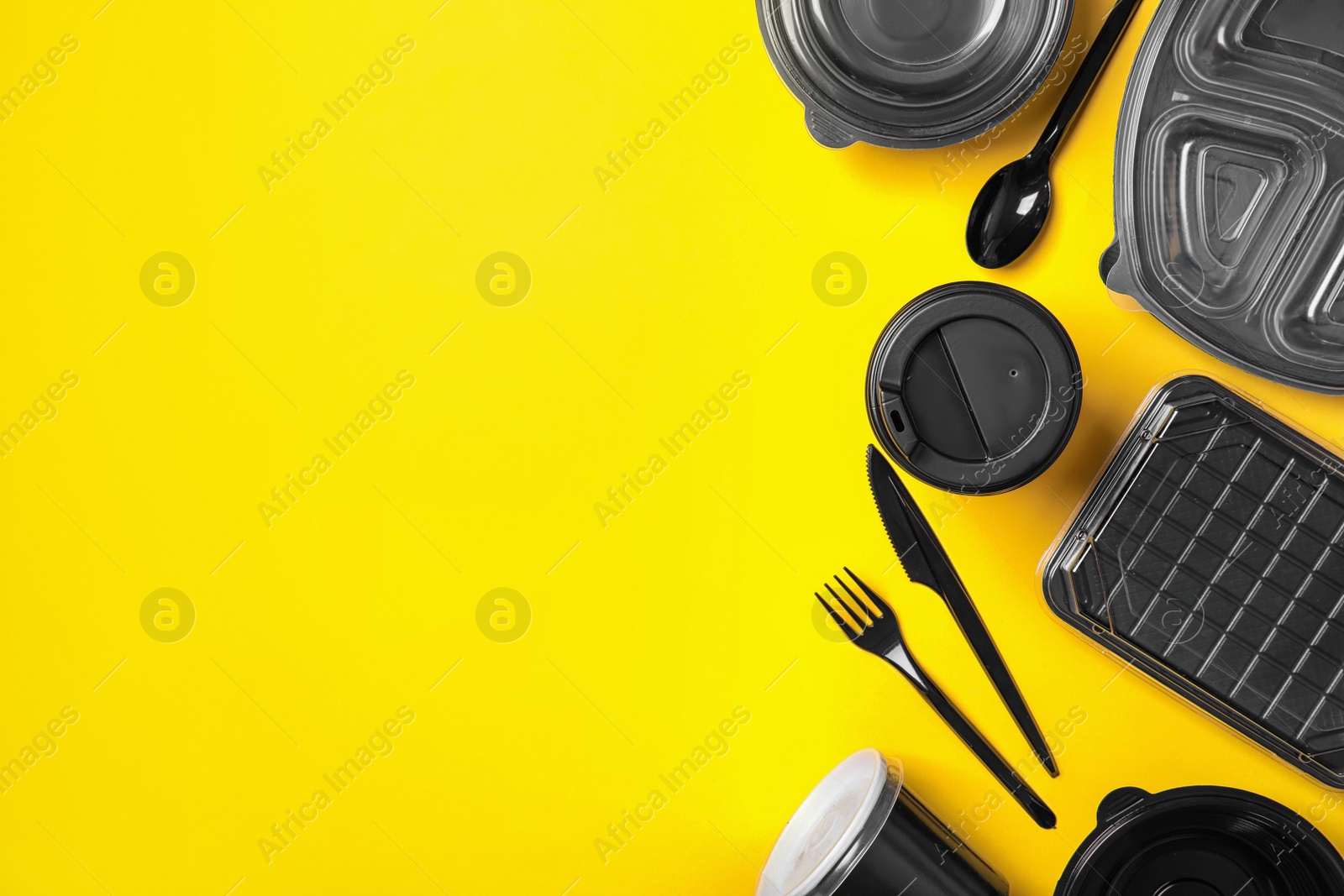 Photo of Different takeout containers on yellow background, flat lay. Food delivery service