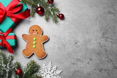 Photo of Flat lay composition with gingerbread man on grey background, space for text