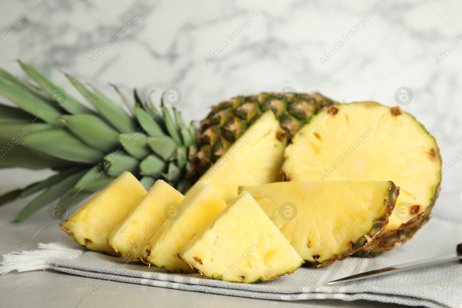 Photo of Slices of fresh juicy pineapple on table