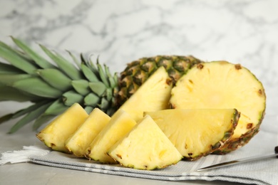 Photo of Slices of fresh juicy pineapple on table