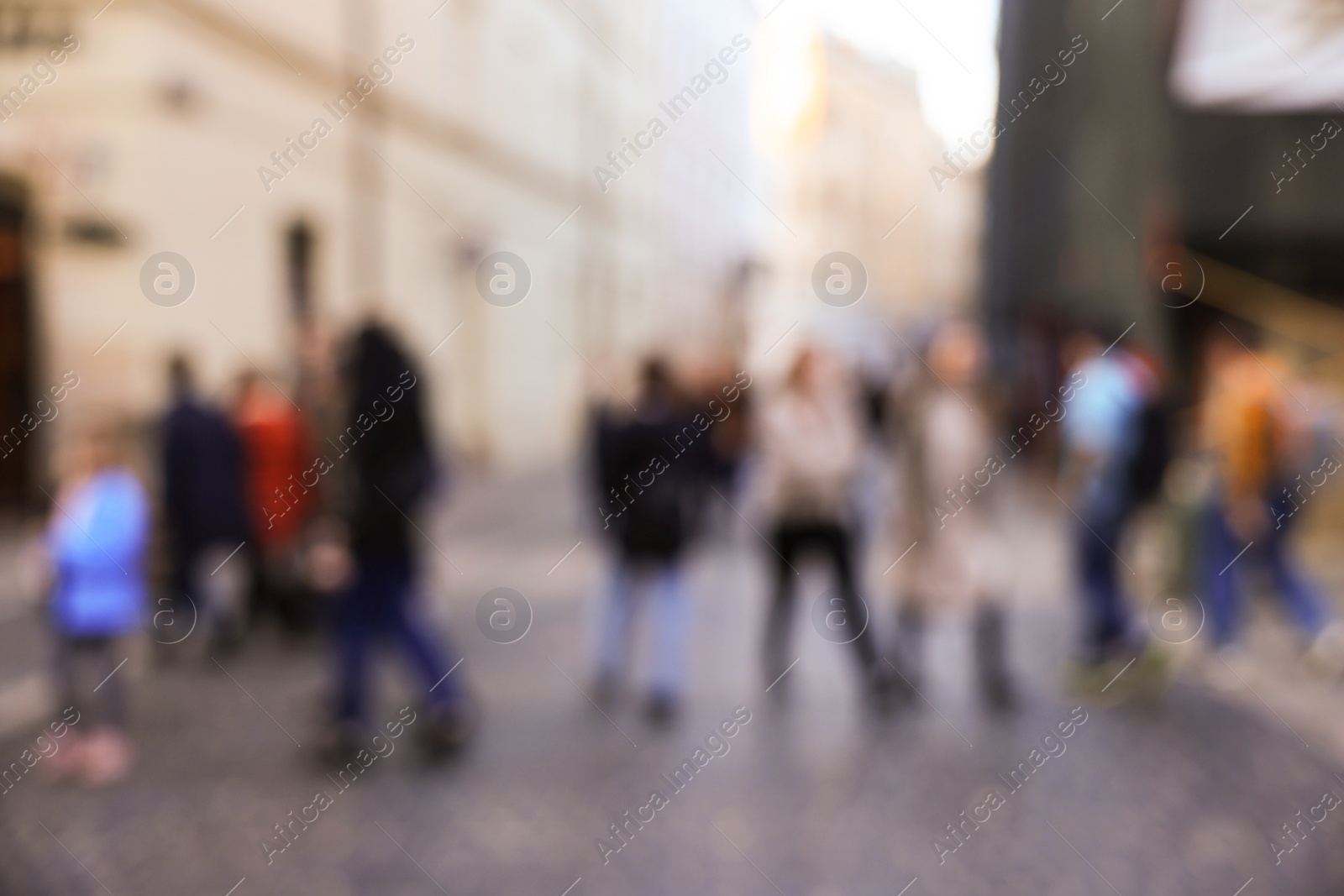 Photo of Blurred view of people walking on city street