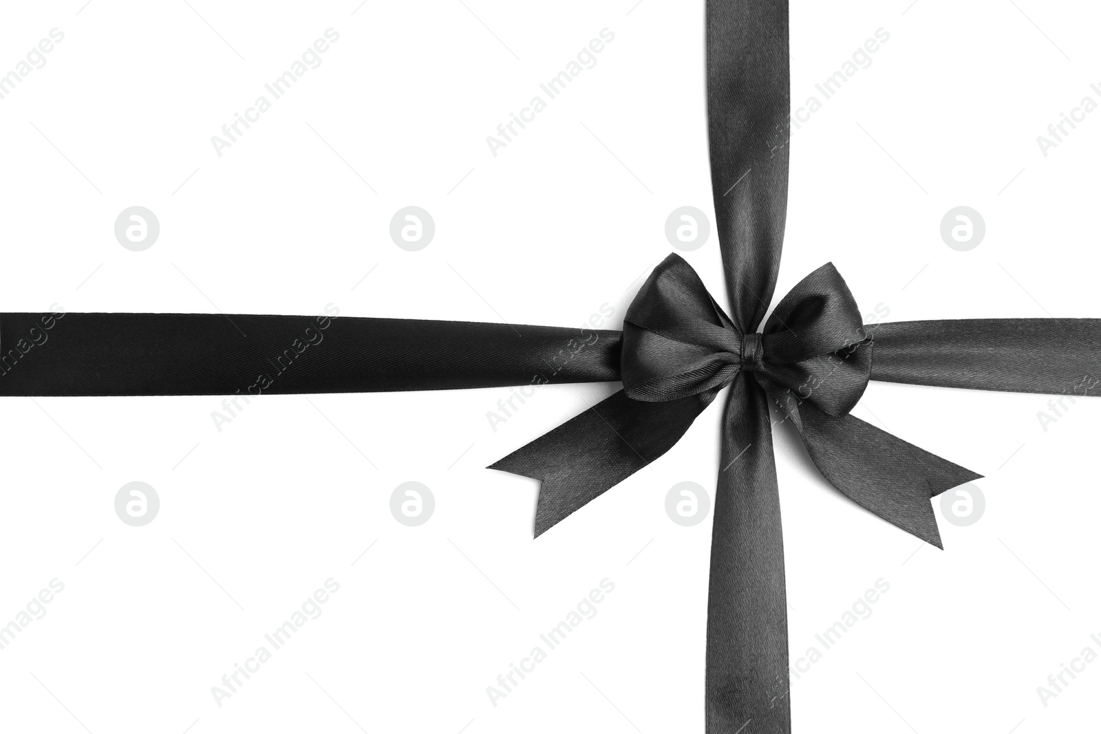 Photo of Black satin ribbon with bow isolated on white, top view