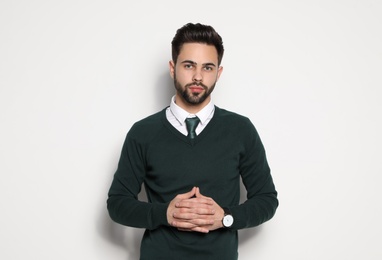 Photo of Portrait of handsome young man on light background