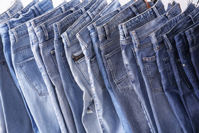 Closeup view of rack with different jeans