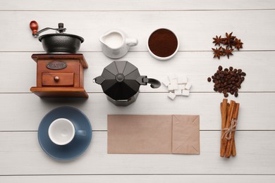 Photo of Flat lay composition with vintage manual coffee grinder and spices on white wooden background