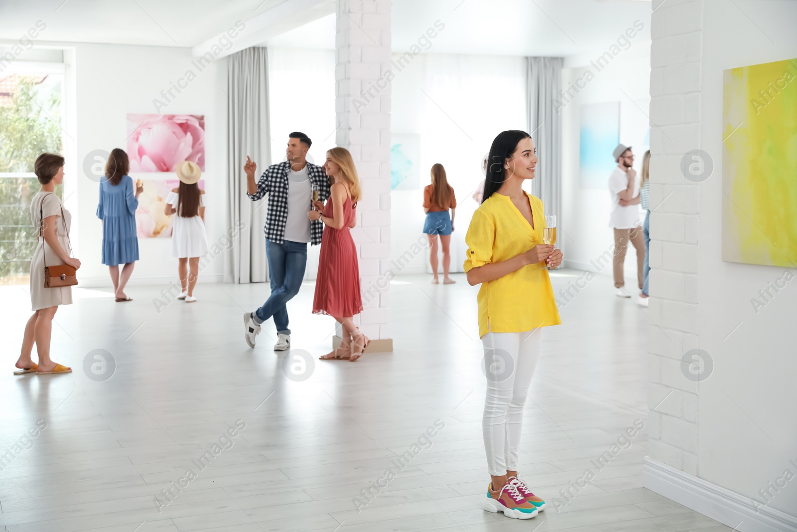 Photo of Group of people at exhibition in art gallery