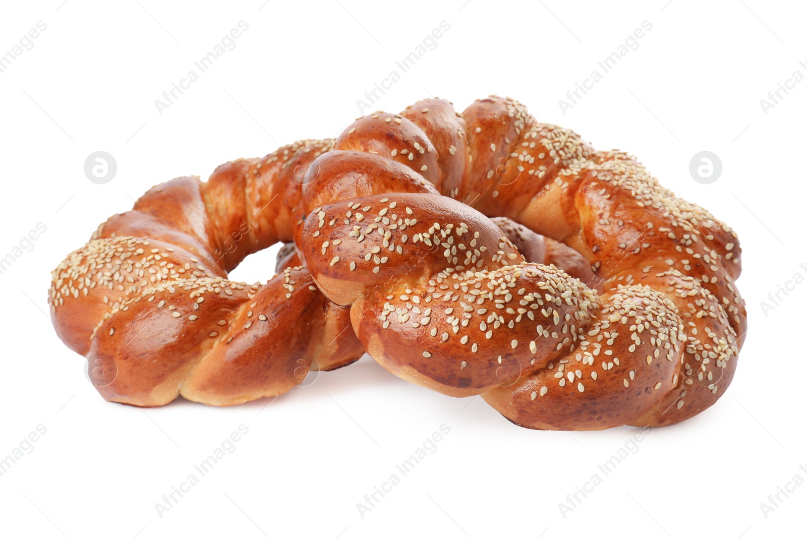 Photo of Round braided breads isolated on white. Fresh pastries