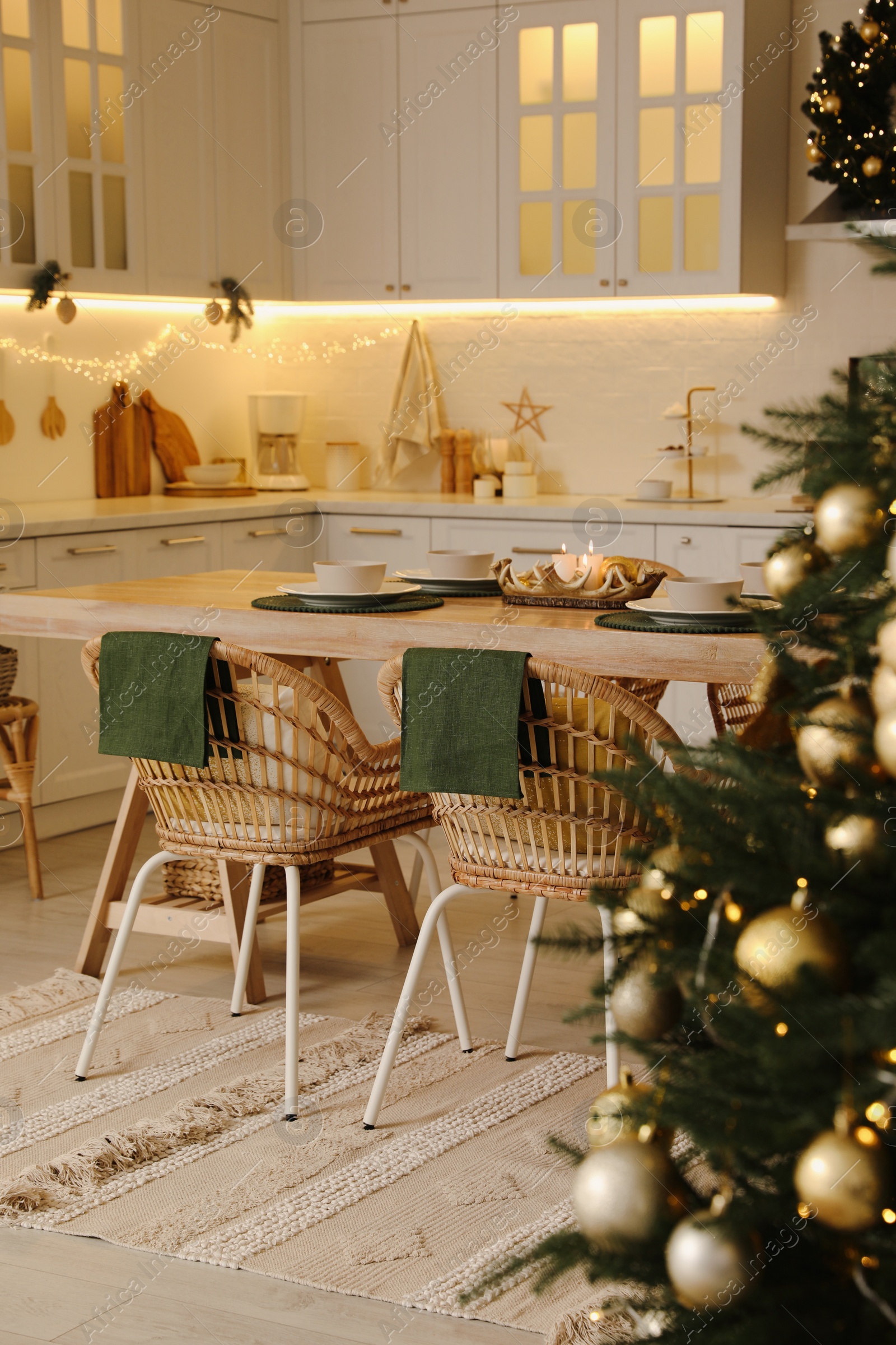 Photo of Cozy kitchen decorated for Christmas dinner. Interior design