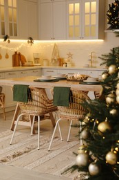 Cozy kitchen decorated for Christmas dinner. Interior design