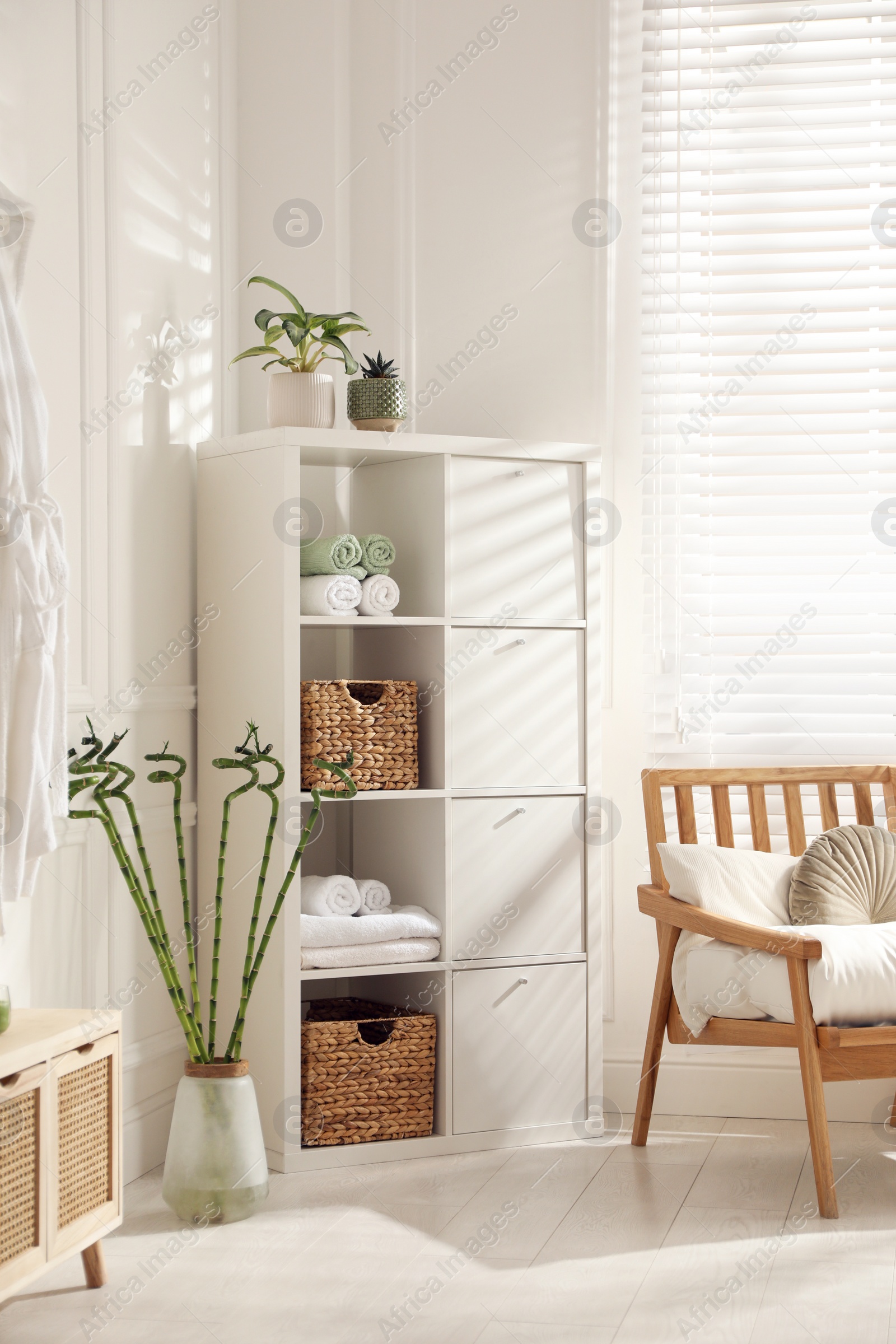 Photo of Beautiful room interior with bamboo and stylish  furniture