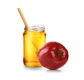 Image of Honey in glass jar and apple isolated on white