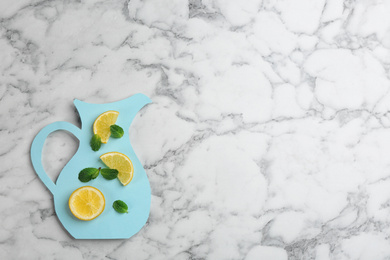 Photo of Creative lemonade layout with lemon slices and mint on white marble table, top view. Space for text