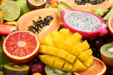 Many different delicious exotic fruits as background, closeup