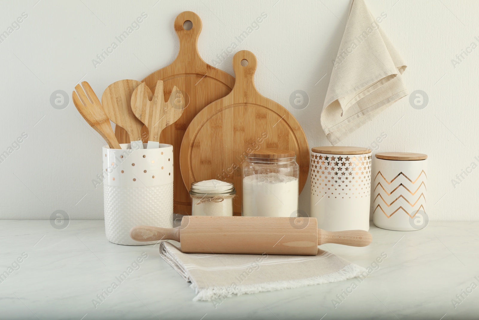 Photo of Modern kitchenware and products on white marble table