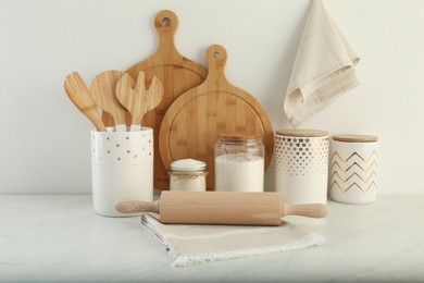 Photo of Modern kitchenware and products on white marble table