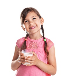 Cute little girl with glass of milk on white background
