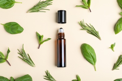 Flat lay composition with herbal essential oil on beige background