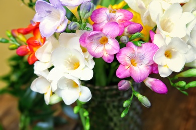 Photo of Beautiful bouquet of freesia flowers, closeup