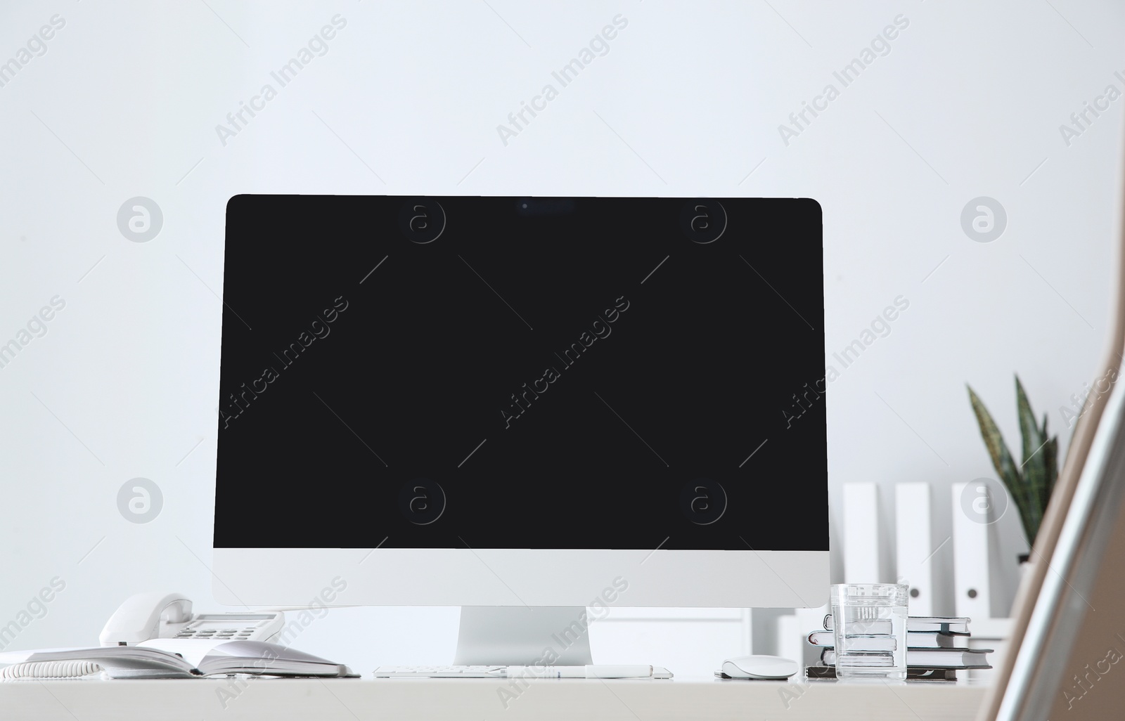 Photo of Stylish workplace with modern computer on desk