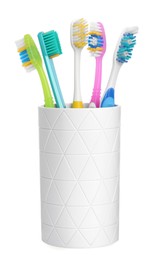 Photo of Different toothbrushes in holder isolated on white