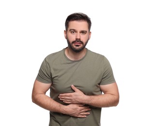 Man suffering from stomach pain on white background